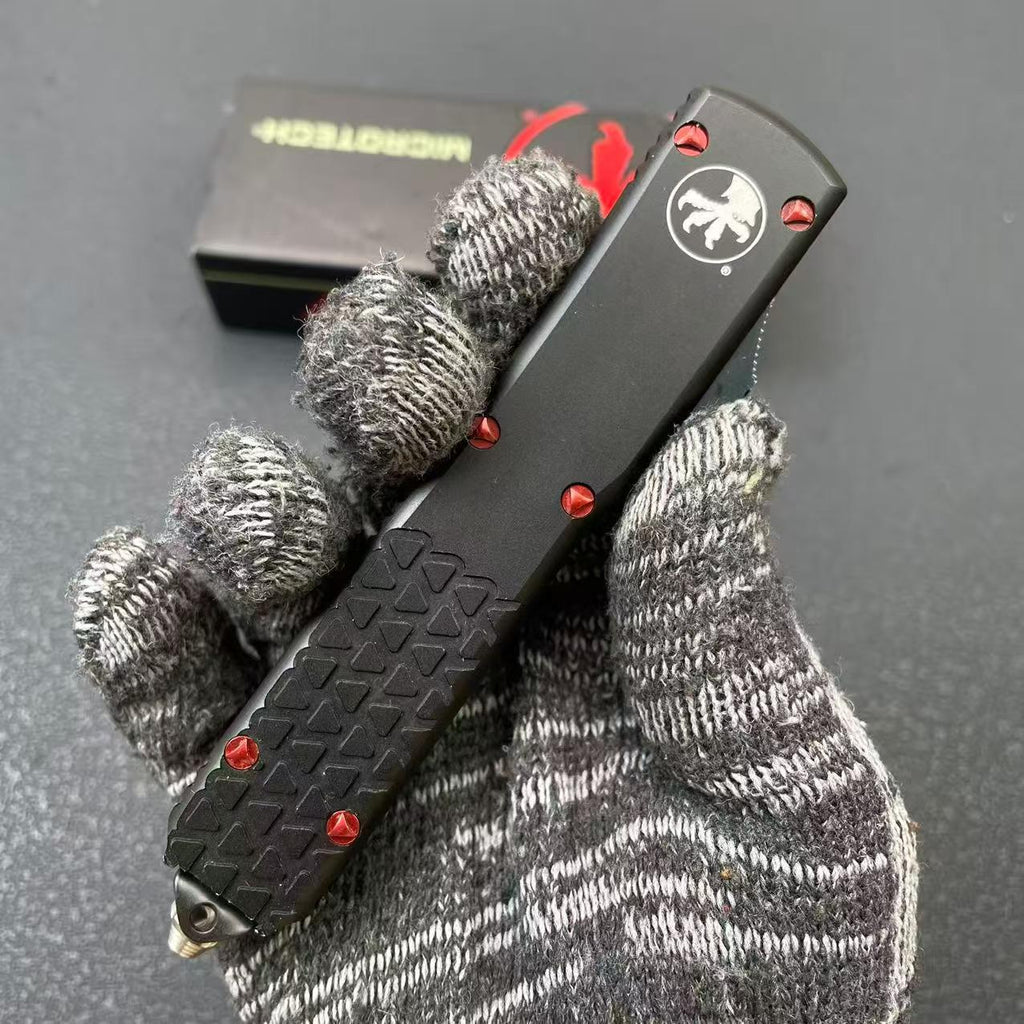 Aluminum Alloy UT85 Serrated Edge Tactical Knife 7CR14MOV